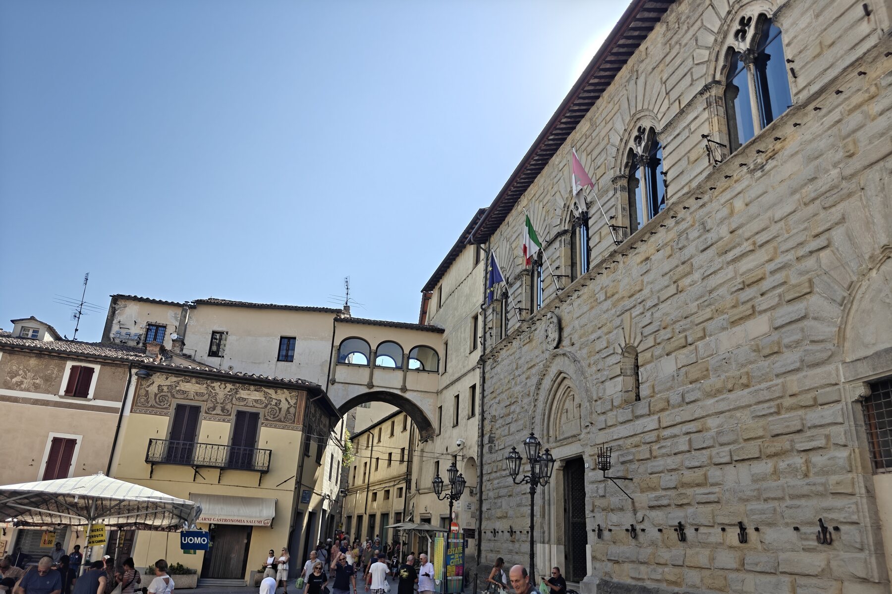 Market stalls below the civic tower in Città di Castello
