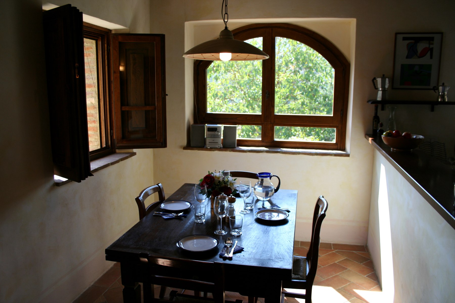 The dining room beside the kitchen, set for a meal