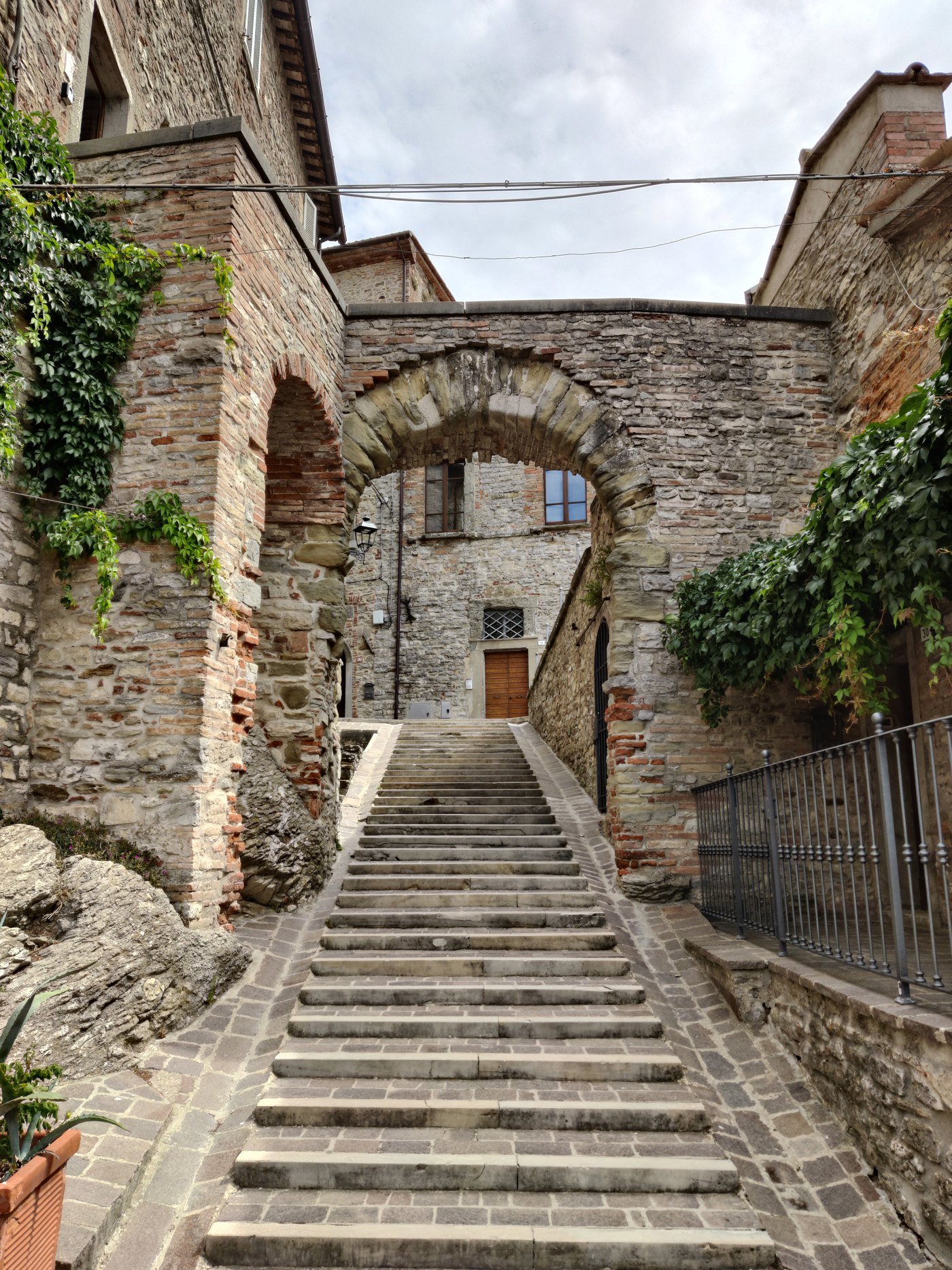 A narrow stone staircase in Monte Santa Maria Tiberina