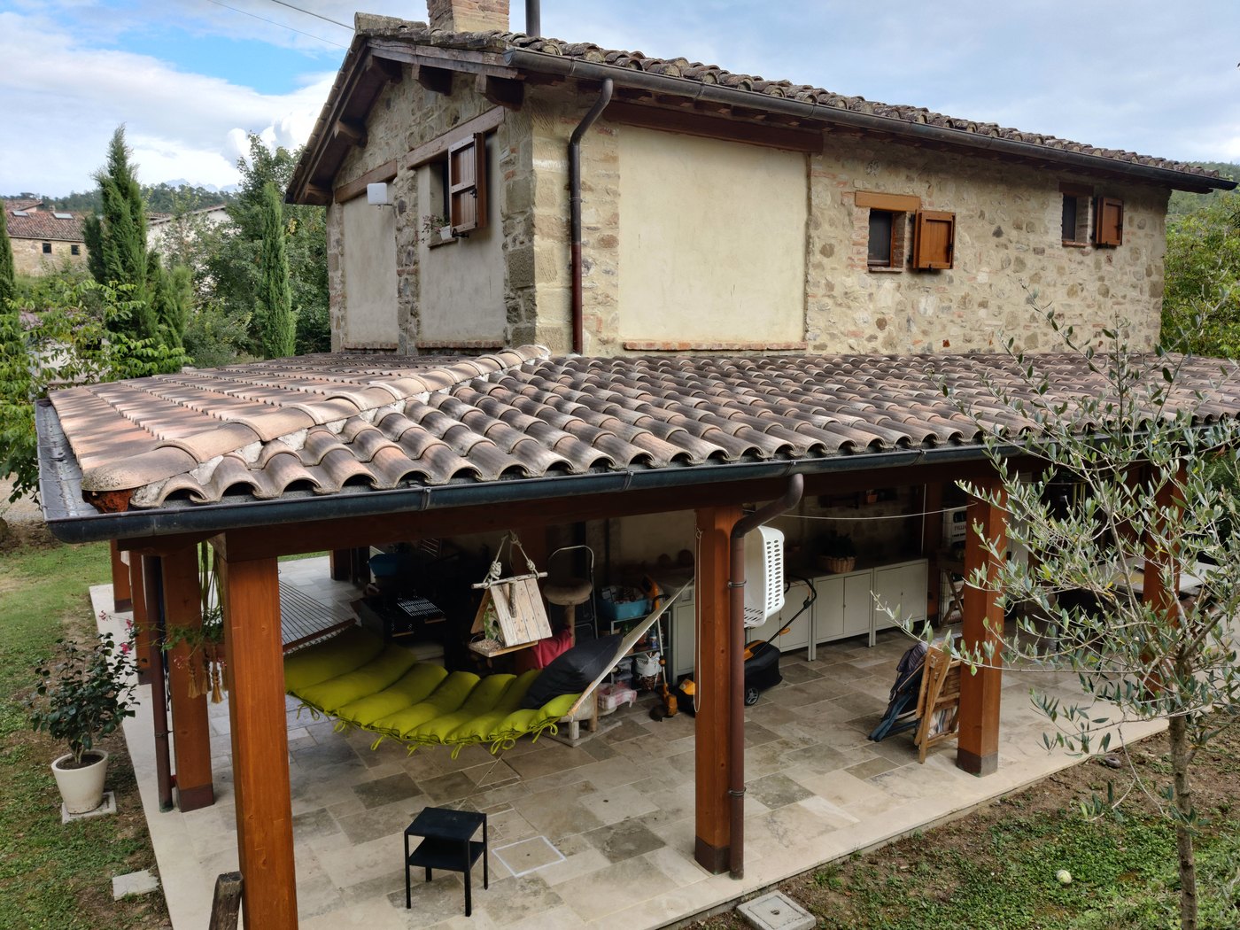 The covered pergola beside the house, looking into the garden
